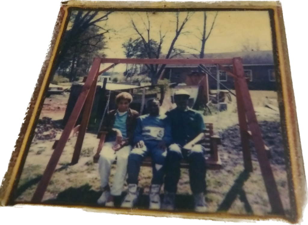 Warren on a swing with his family